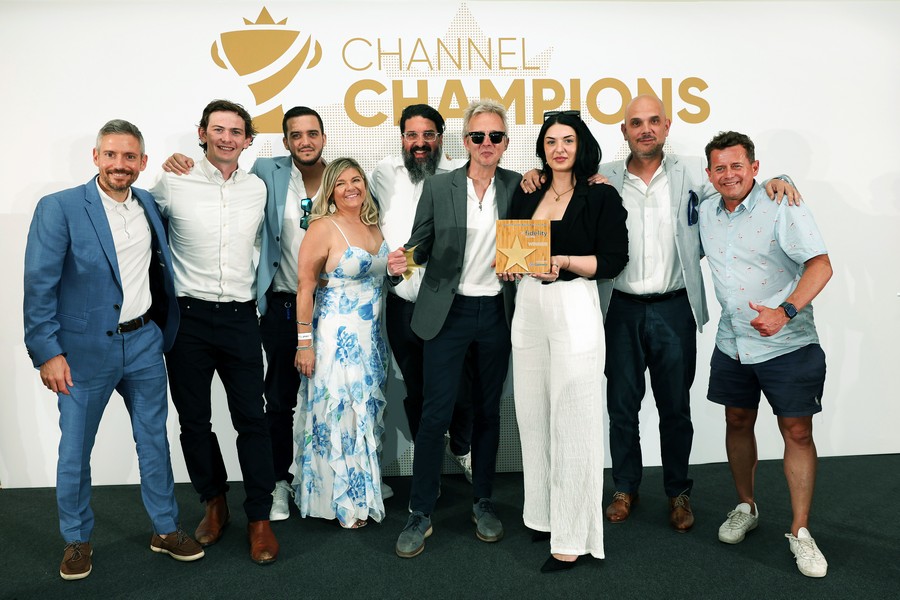 Winners of an award holding a trophy