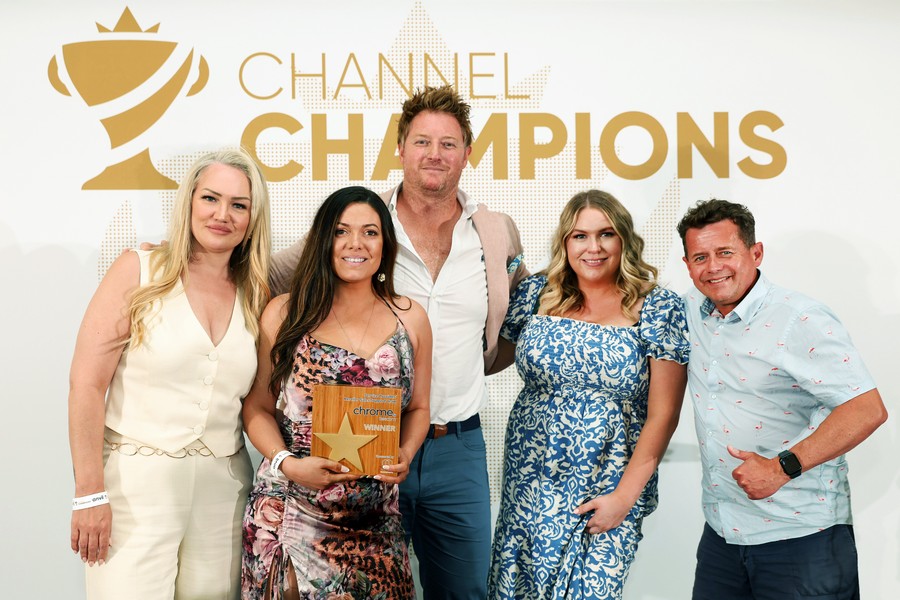 Winners of an award holding a trophy