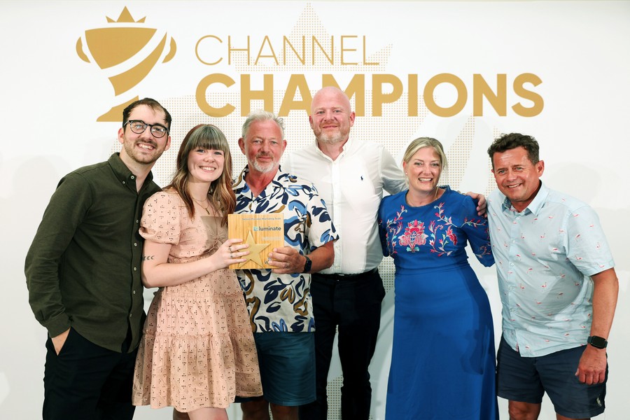 Winners of an award holding a trophy