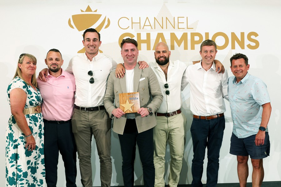 Winners of an award holding a trophy