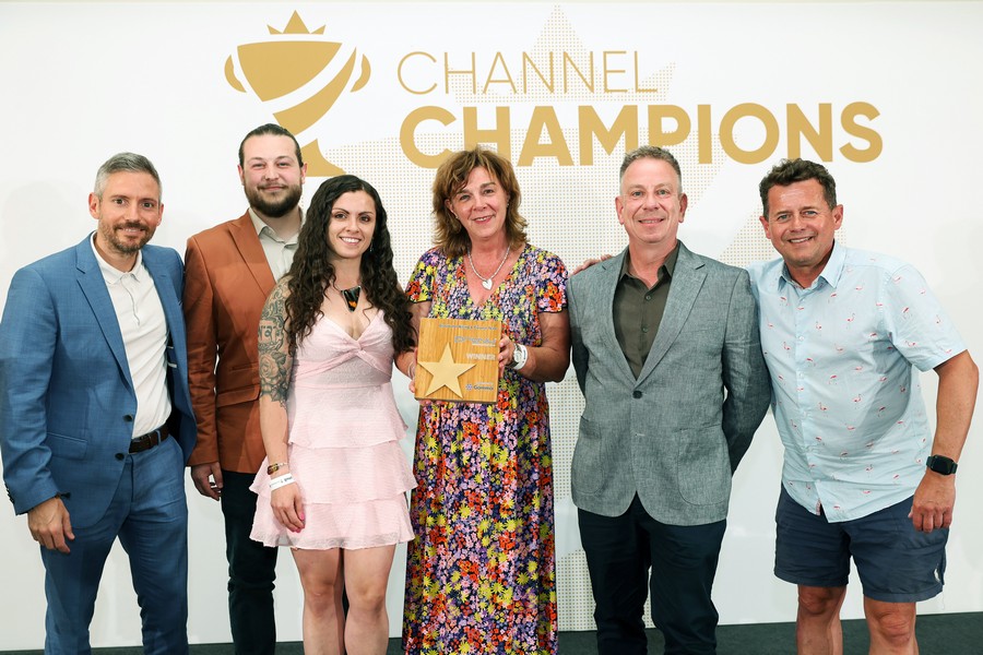 Winners of an award holding a trophy