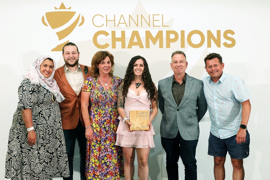 Winners of an award holding a trophy